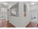 Hallway with hardwood floors and open concept at 215 Eyam Hall Ln, Apex, NC 27502
