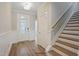 Light and bright entryway with staircase and wood floors at 215 Kitty Branch Way, Smithfield, NC 27577