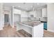 Modern kitchen with white cabinets and granite island at 9744 Bear Run Ln, Middlesex, NC 27557