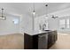 Modern kitchen island with white countertop and dark cabinetry at 2337 E Main St, Durham, NC 27703