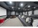 Basement home theater with tiered seating, large screen, and comfortable seating at 12660 Boyce Milll Road, Raleigh, NC 27613