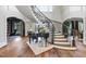 Spacious entryway showcasing a grand staircase and hardwood floors at 12660 Boyce Milll Road, Raleigh, NC 27613