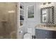 Modern bathroom with a walk-in shower, stylish vanity, and a window at 12660 Boyce Milll Road, Raleigh, NC 27613