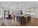 Open kitchen with large island, breakfast area and hardwood floors at 12660 Boyce Milll Road, Raleigh, NC 27613