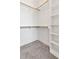 Spacious walk-in closet with ample shelving and hanging rods at 2333 E Main St, Durham, NC 27703