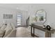 Bright and airy entryway with modern console table, hardwood floors, and a view into the living room at 2333 E Main St, Durham, NC 27703