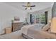 Large bedroom with king bed, backyard views, and a workspace at 7719 Berry Crest Ave, Raleigh, NC 27617