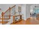 Elegant entryway with hardwood floors, staircase, and console table at 7719 Berry Crest Ave, Raleigh, NC 27617