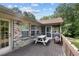 Spacious deck with picnic table, grill, and wooded views at 455 Buie Rd, Broadway, NC 27505