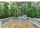 Spacious deck with white railings overlooking the backyard at 116 Oak Ridge Dr, Willow Springs, NC 27592