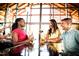 Relaxed community bar with people enjoying drinks and conversation at 201 Big Bradley Dr, Wendell, NC 27591