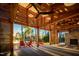 Covered patio with fireplace and comfortable seating at 201 Big Bradley Dr, Wendell, NC 27591