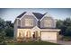 Two-story house with gray siding, stone accents, and a two-car garage at 1110 Jersey St, Haw River, NC 27258