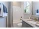 Modern bathroom with white herringbone tile, granite countertop, and bathtub at 173 Ascot, Rocky Mount, NC 27804