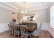 Elegant dining room featuring a large table, chandelier, and hardwood floors at 173 Ascot, Rocky Mount, NC 27804