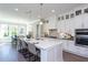 Spacious kitchen boasts white cabinets, quartz countertops, and stainless steel appliances at 173 Ascot, Rocky Mount, NC 27804