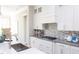 Modern kitchen with white cabinets, gray quartz countertops, and a gas cooktop at 173 Ascot, Rocky Mount, NC 27804