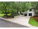 White brick home with two-car garage and driveway at 1201 Bancroft St, Raleigh, NC 27612