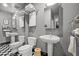 Basement bathroom with double sinks and pedestal vanities at 1201 Bancroft St, Raleigh, NC 27612