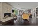 Living room features a fireplace, built-in shelving and access to backyard at 1201 Bancroft St, Raleigh, NC 27612