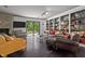 Spacious living room with dark hardwood floors, built-in shelving, and fireplace at 1201 Bancroft St, Raleigh, NC 27612