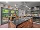 Modern kitchen with stainless steel appliances and a large island at 1201 Bancroft St, Raleigh, NC 27612