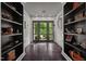 Bright entryway with dark hardwood floors and built-in shelving at 1201 Bancroft St, Raleigh, NC 27612