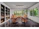 Bright dining room with hardwood floors, built-in shelving and garden views at 1201 Bancroft St, Raleigh, NC 27612