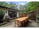 Outdoor patio with dining area and built in grill at 1201 Bancroft St, Raleigh, NC 27612