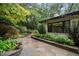 Landscaped backyard with flagstone patio and string lights at 1201 Bancroft St, Raleigh, NC 27612