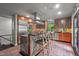 Modern kitchen with stainless steel appliances and an island with seating at 1201 Bancroft St, Raleigh, NC 27612