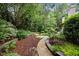 Landscaped gardens with stone pathway and lush greenery at 1201 Bancroft St, Raleigh, NC 27612