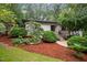 White brick ranch home with landscaped yard at 1201 Bancroft St, Raleigh, NC 27612