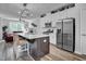 Modern kitchen with stainless steel appliances and an island with seating at 5436 Crescent Square St, Raleigh, NC 27616