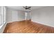 Bright bedroom with hardwood floors and ceiling fan at 605 Quarry St, Raleigh, NC 27601