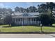 Charming one-story home with a front porch and a well-maintained lawn at 409 W Main St, Spring Hope, NC 27882