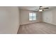 Bright bedroom with double doors to closet and a ceiling fan at 219 Clearwater Hbr, Sanford, NC 27332