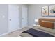 Well-lit bedroom with neutral walls and plenty of closet space at 202 Linden Park Ln, Cary, NC 27519