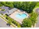 Community pool with a clubhouse and plenty of lounge chairs at 202 Linden Park Ln, Cary, NC 27519
