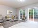 Bright living room with large windows and access to a deck at 202 Linden Park Ln, Cary, NC 27519