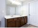 Double vanity bathroom with dark wood cabinets and ample counter space at 202 Linden Park Ln, Cary, NC 27519