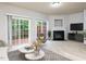 Spacious living room with fireplace and sliding glass doors leading to a deck at 202 Linden Park Ln, Cary, NC 27519