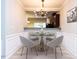 Elegant dining area with chandelier and view of the kitchen at 202 Linden Park Ln, Cary, NC 27519