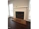 Brick fireplace with white mantel in living room at 1206 Berley Ct, Raleigh, NC 27609