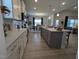 Modern kitchen features white cabinets, an island, and spacious countertops at 1491 Pecan Dr # Model Home, Nashville, NC 27856
