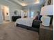 Main bedroom with plush carpeting and access to private bathroom at 1491 Pecan Dr # Model Home, Nashville, NC 27856