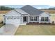 Two-story home with stone and siding exterior at 1491 Pecan Dr # Model Home, Nashville, NC 27856