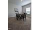 Dining area with table and four chairs, carpeted floor at 1491 Pecan Dr # Model Home, Nashville, NC 27856