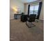Home office with desk, two chairs, and large window at 1491 Pecan Dr # Model Home, Nashville, NC 27856