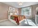 Cozy bedroom with a colorful bedspread, large window, and ample sunlight at 141 Traceway N, Sanford, NC 27332